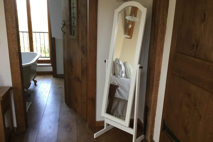 Rose bedroom looking into ensuite bathroom